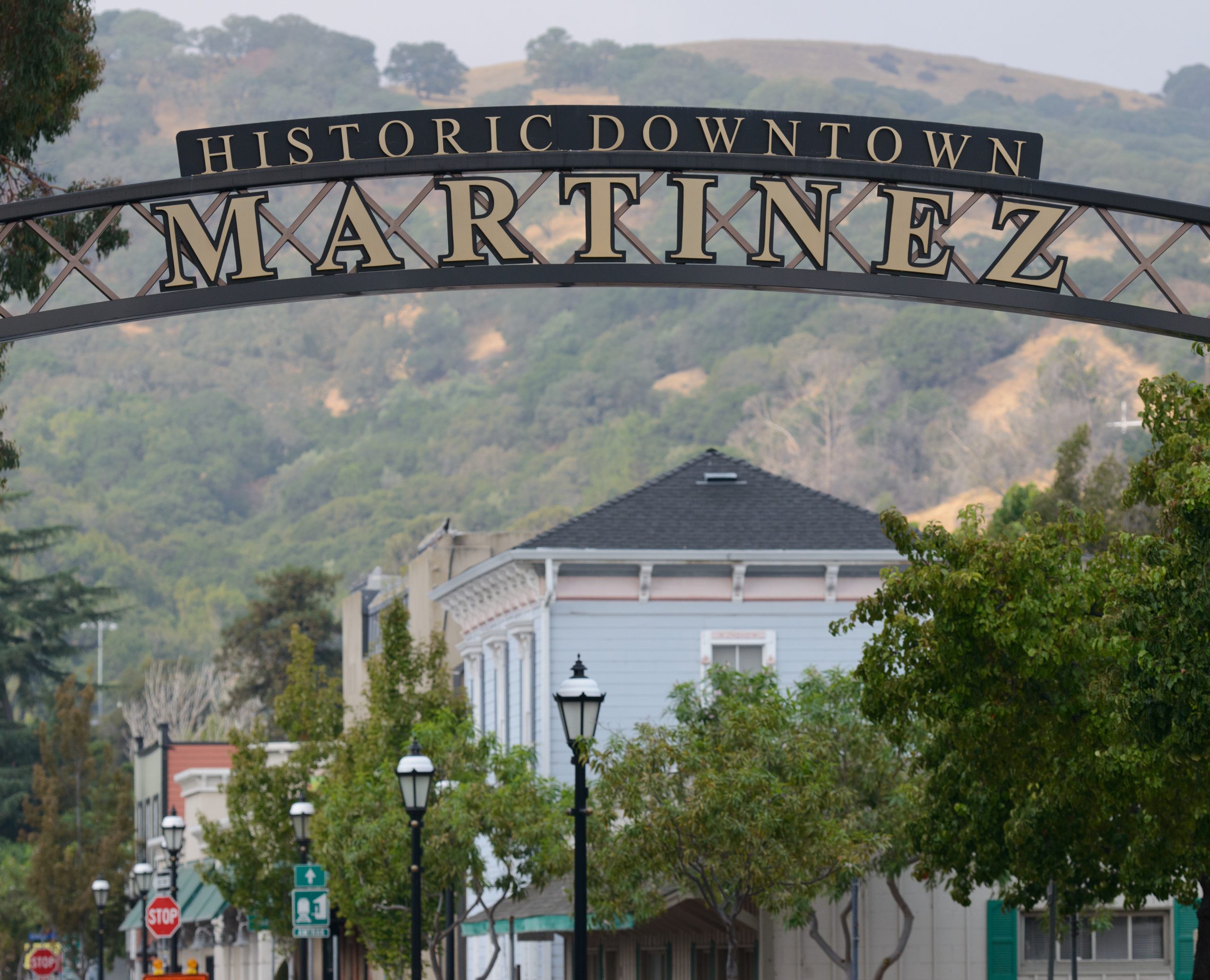 Historic Downtown Martinez Sign with Buildings in View