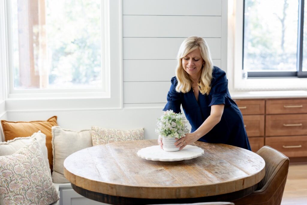 Lisa adding a decor at table top decor