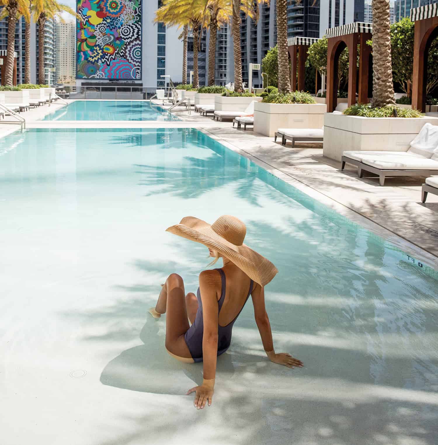 Modern architecture of Marina Condos in Puerto Cancun featuring luxury waterfront apartments and private docks.