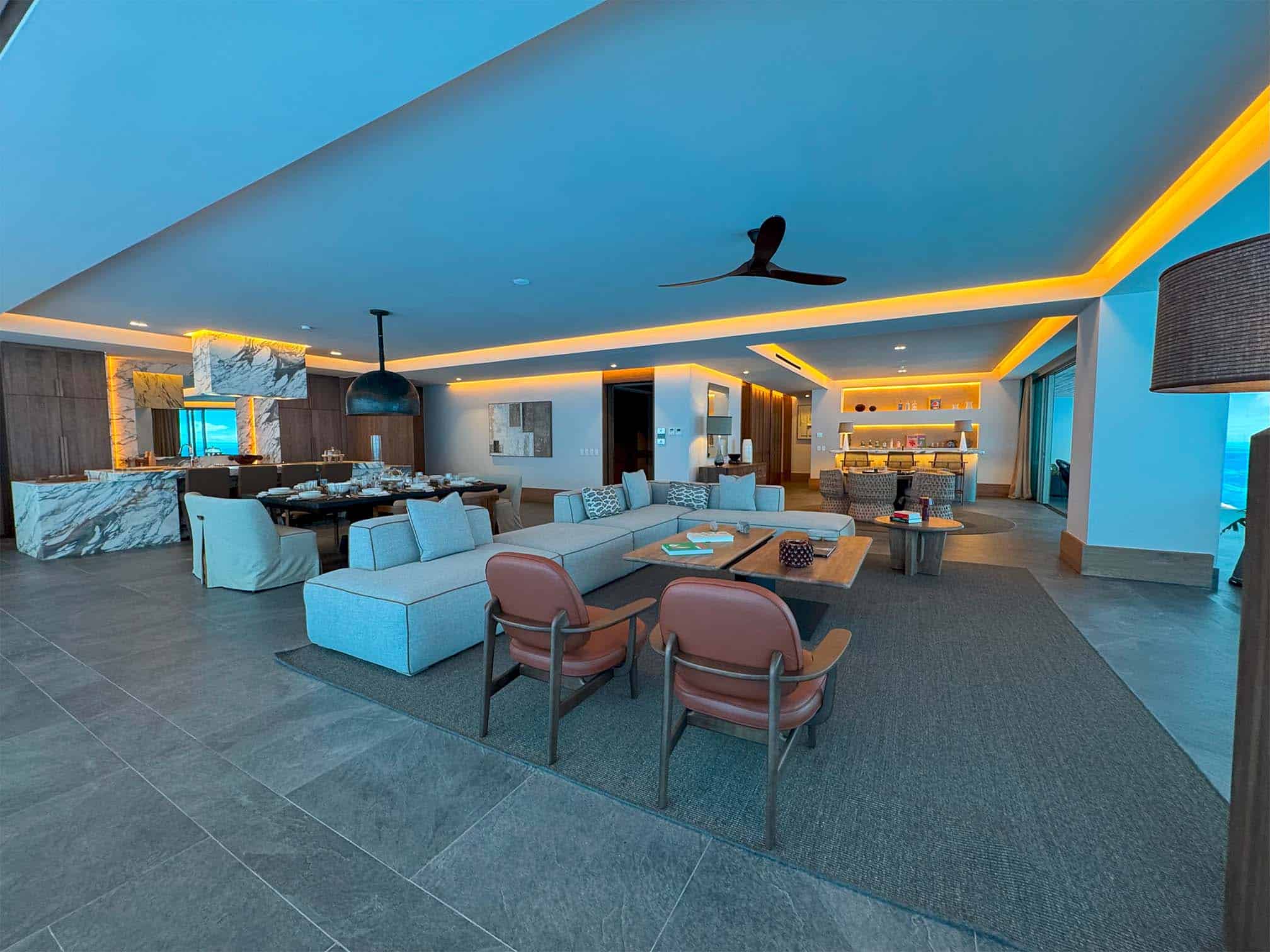 Open-concept luxury living and dining area with ocean views in Thompson Private Residences.