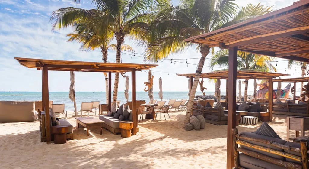 Private beach club access for residents at SLS Puerto Cancún Resort.