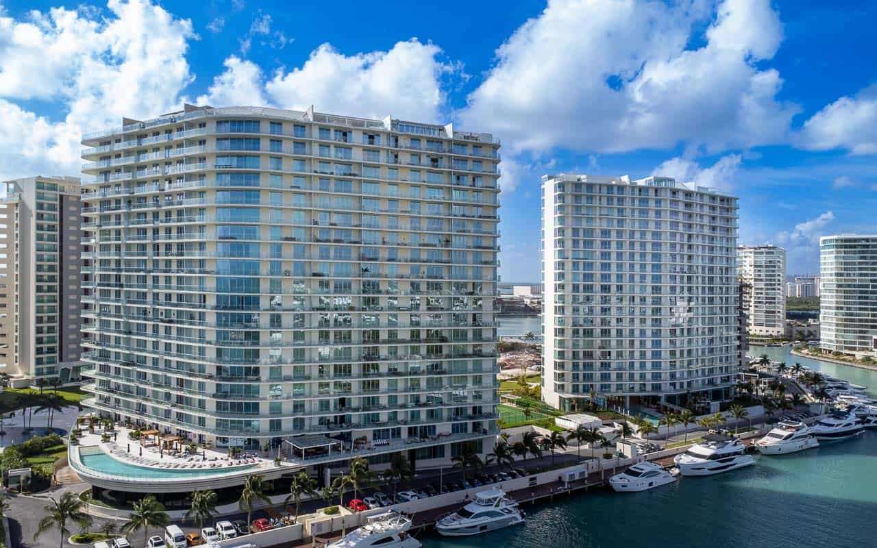 Modern luxury condo exterior at SLS Puerto Cancún Residences with ocean view.