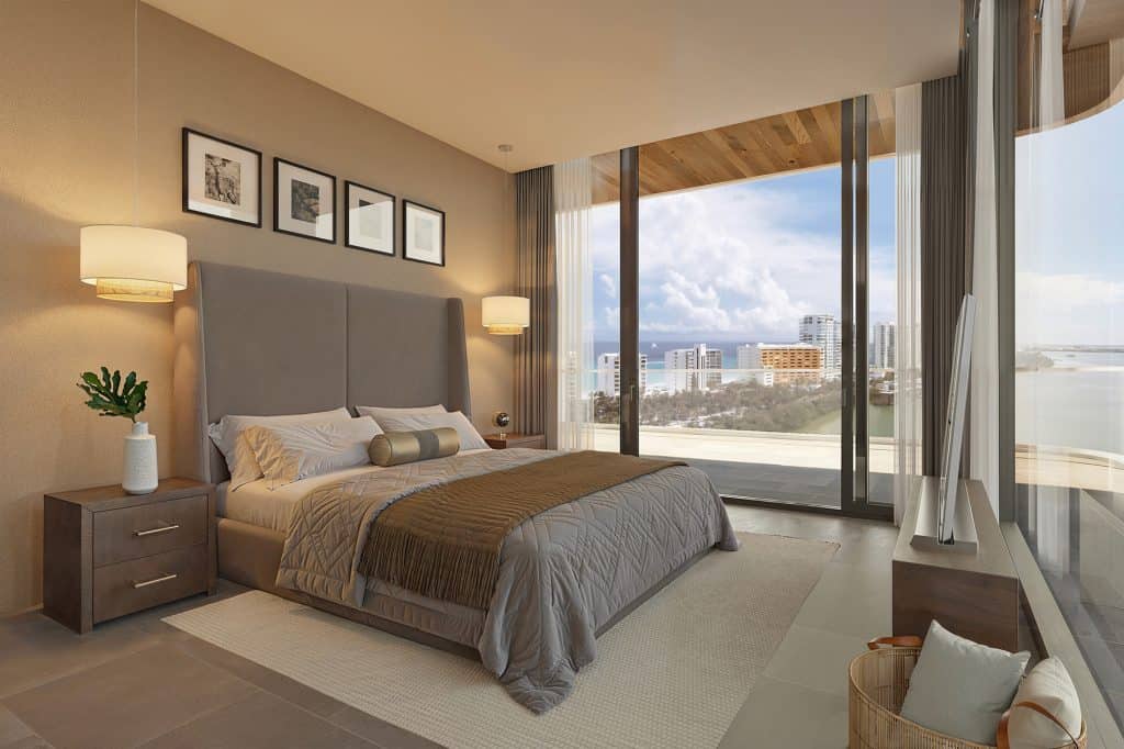 Luxury bedroom suite at Azurea Cancun offering stunning views of the Caribbean horizon.