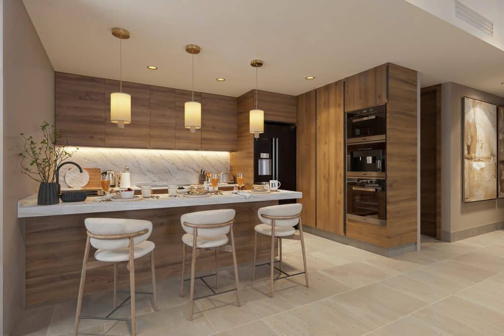 High-end modern kitchen with marble countertops and custom cabinetry in an Azurea Cancun condo.