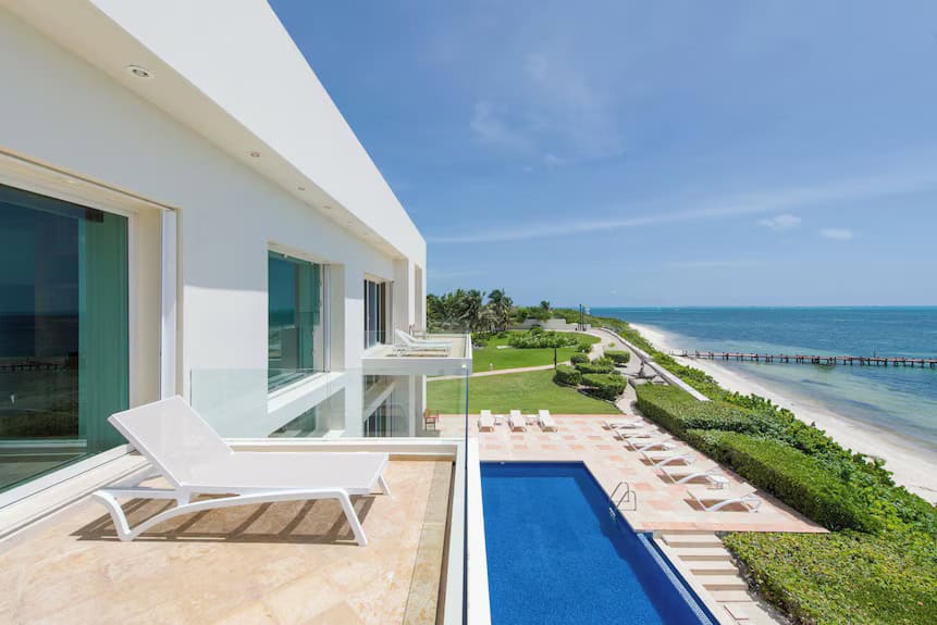 View of a modern architectural beachfront home located in Cancun, Mexico.