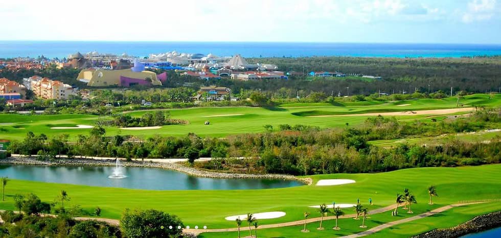 Spacious terrace view of a manicured golf course fairway in Cancun