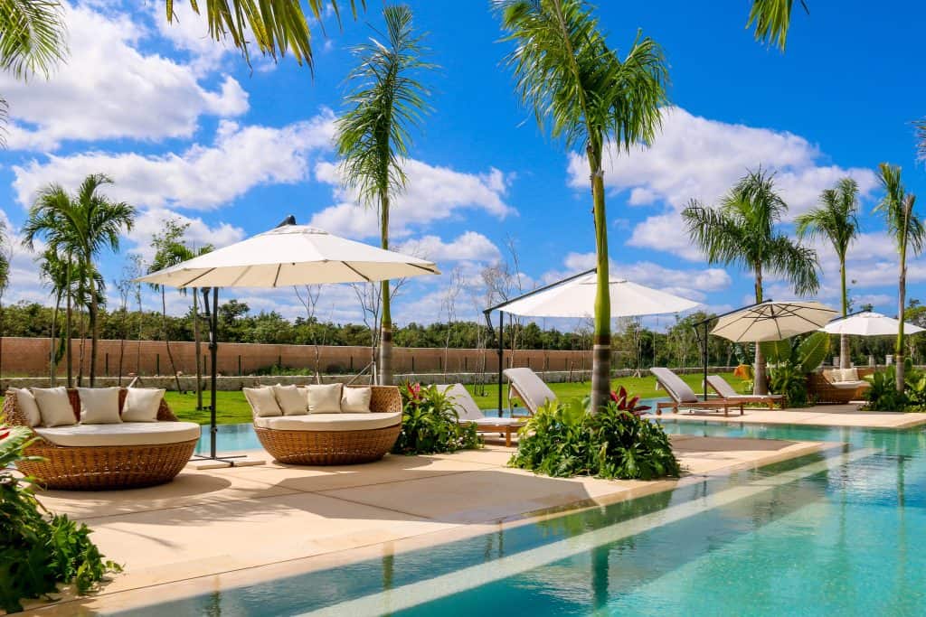 Shared pool and garden area in a secure residential complex in Cancun.