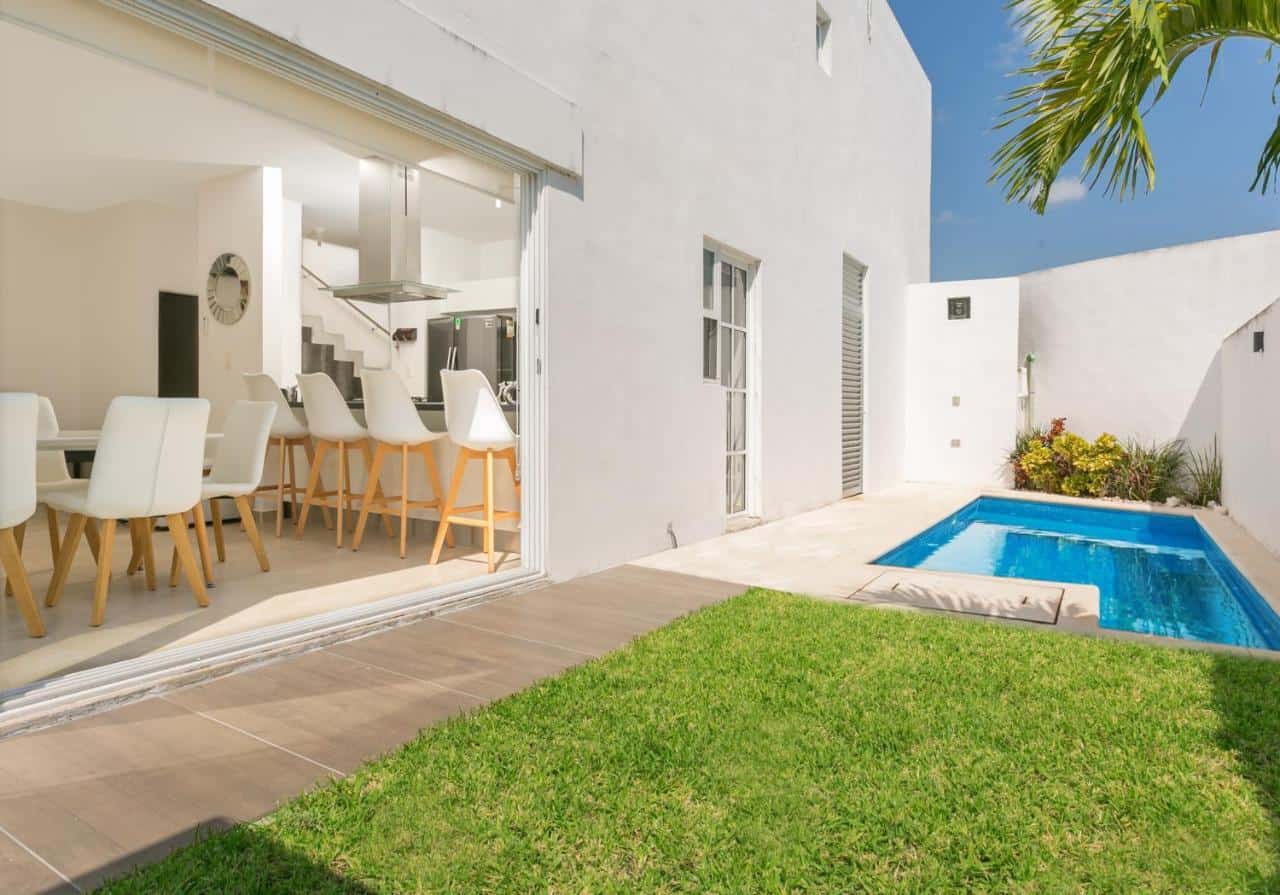 Modern gated community house exterior for sale in Cancun, Mexico