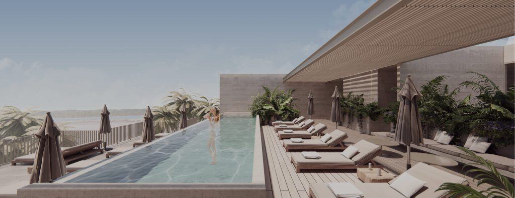 Infinity pool and lounge area at Lumia Residencial development