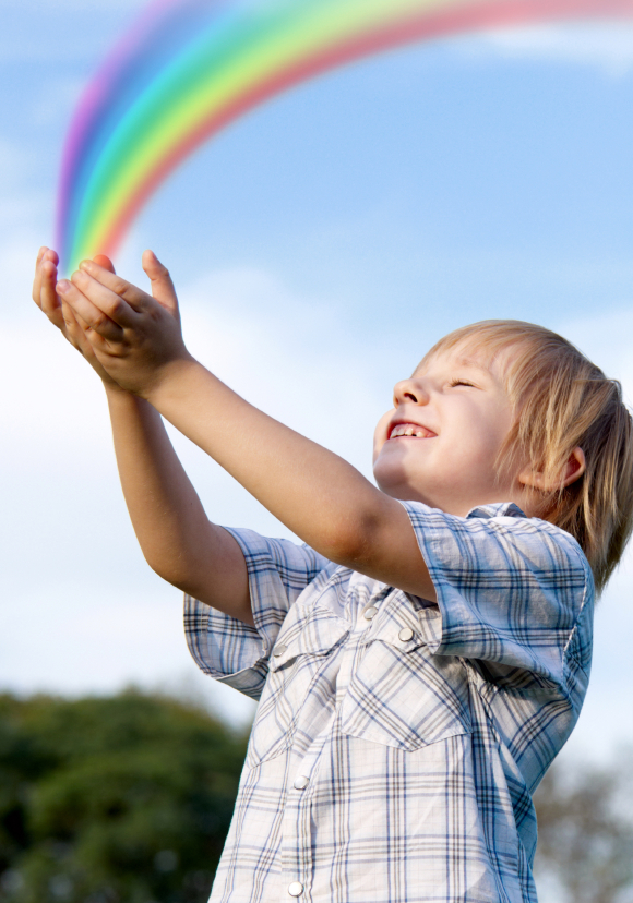 The little boy with stretched hands to sky