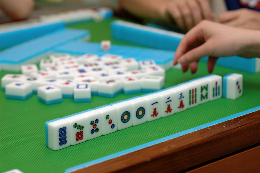 People playing mahjong on a table