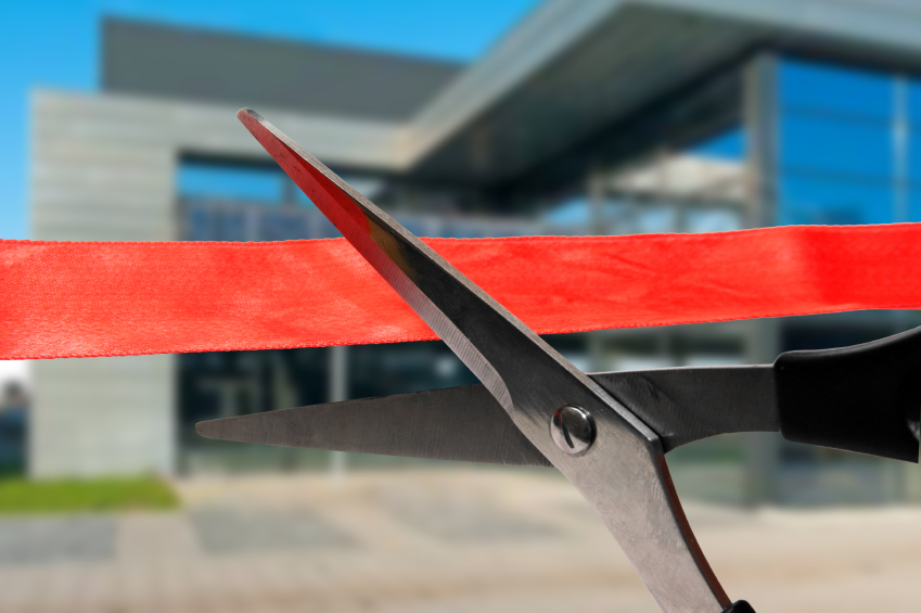 business building opening ceremony - cutting red ribbon