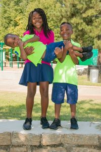Image is of three American students.
