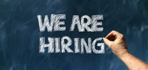 Image is of the words we are hiring written in chalk. Image is of the words we are hiring written in chalk.