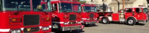 Image is a line of Culver City Fire Department fire trucks. Image is a line of Culver City Fire Department fire trucks.