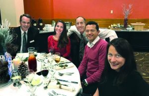 Image is picture of Shenshu Marathon runners at holiday dinner party.