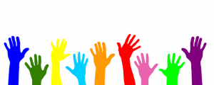 Image is a line of volunteer hands in different colors. Image is a line of volunteer hands in different colors.