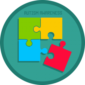 Image is a circle with puzzle pieces inside with a banner that says Autism Awareness.