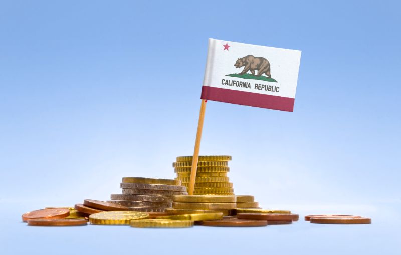 flag of california in a stack of coins