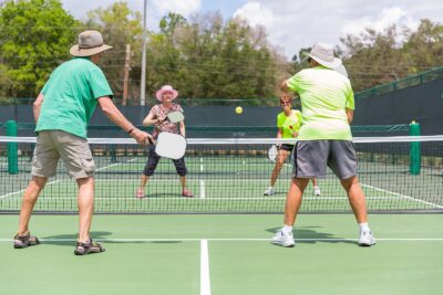 Pickleball players. Image from TheVillagesFL, CC BY-SA 4.0 , via Wikimedia Commons