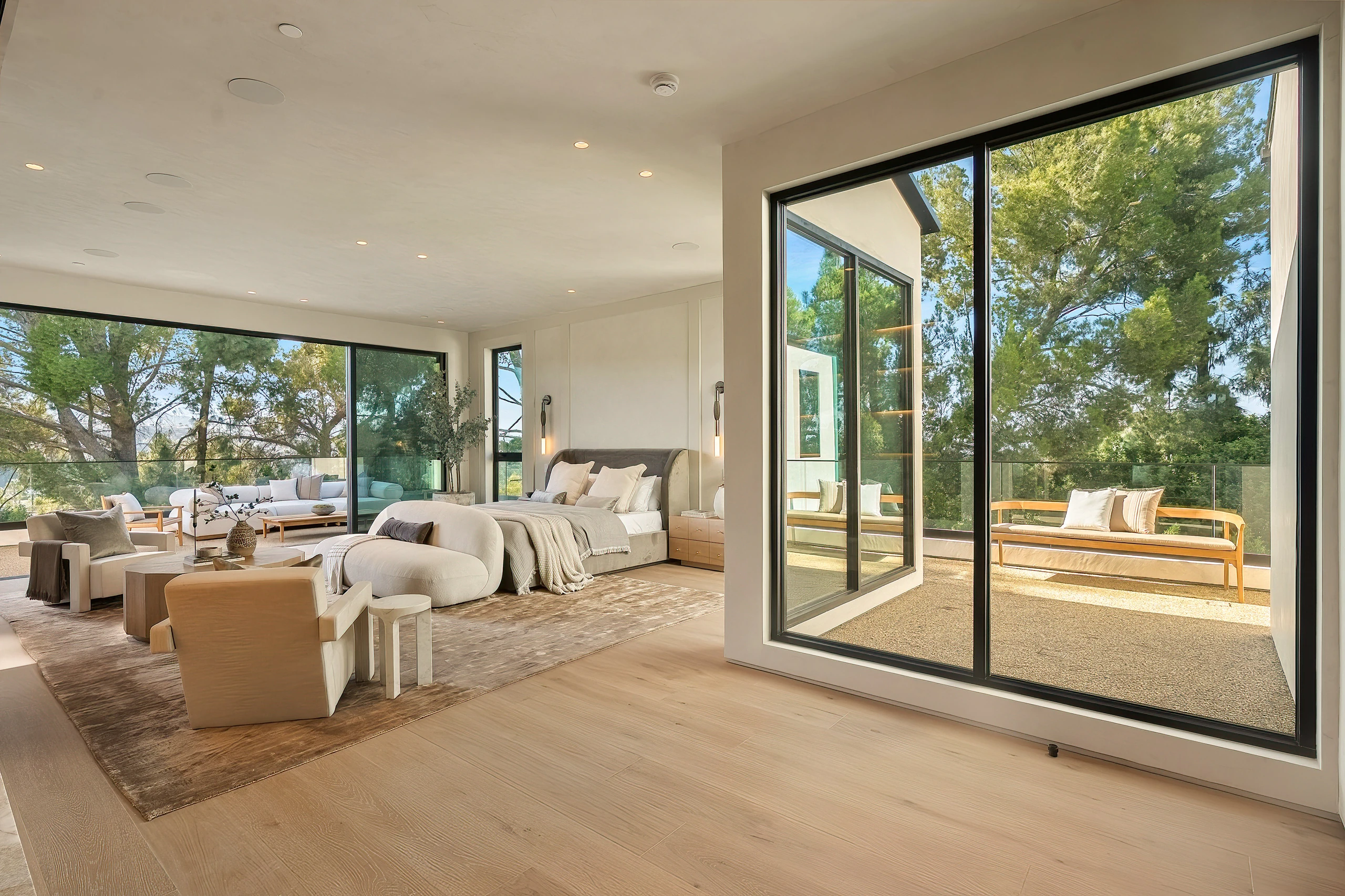 The primary suite with doors to the balcony
