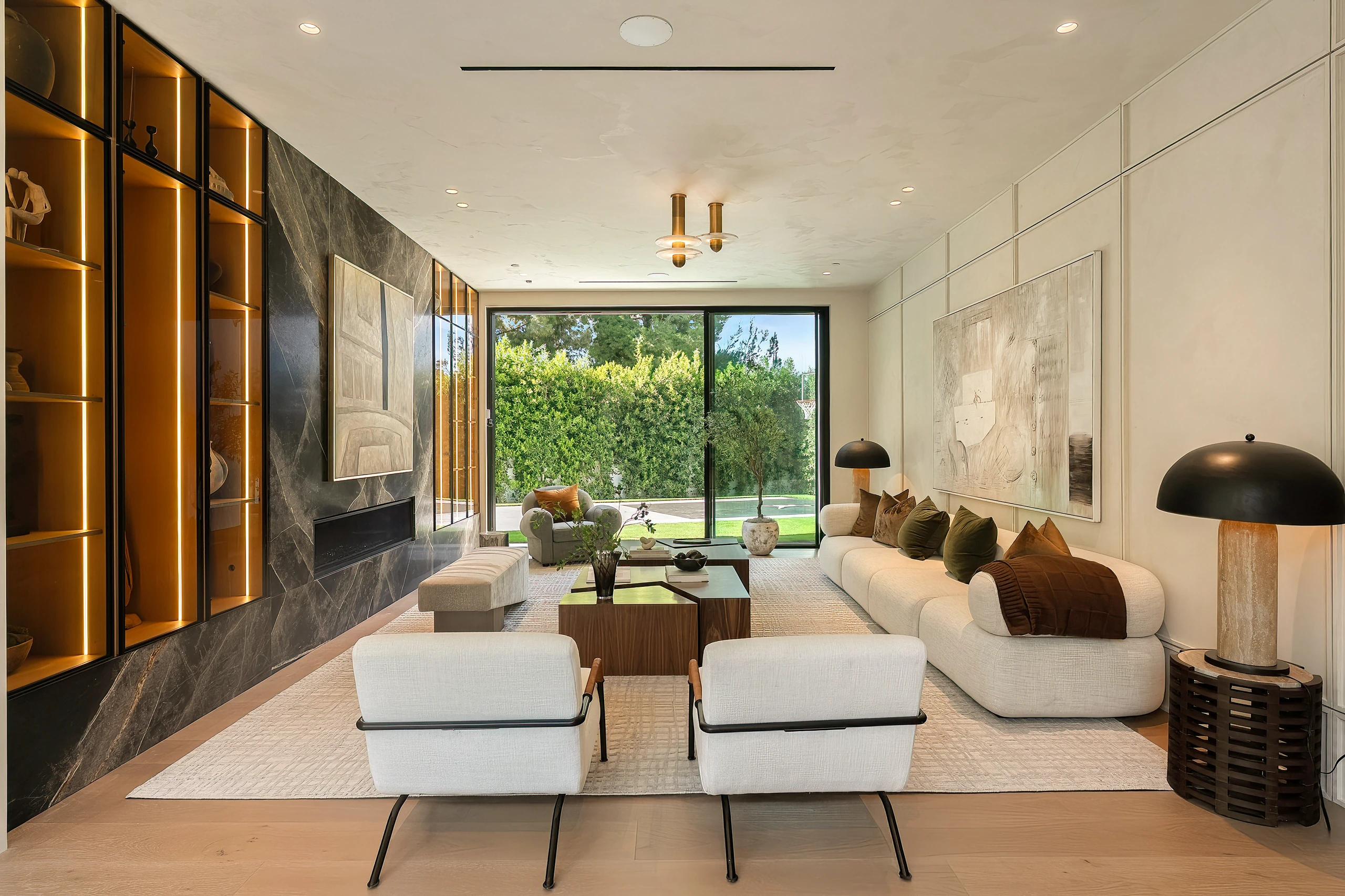 The living room with a fireplace and built-in shelving