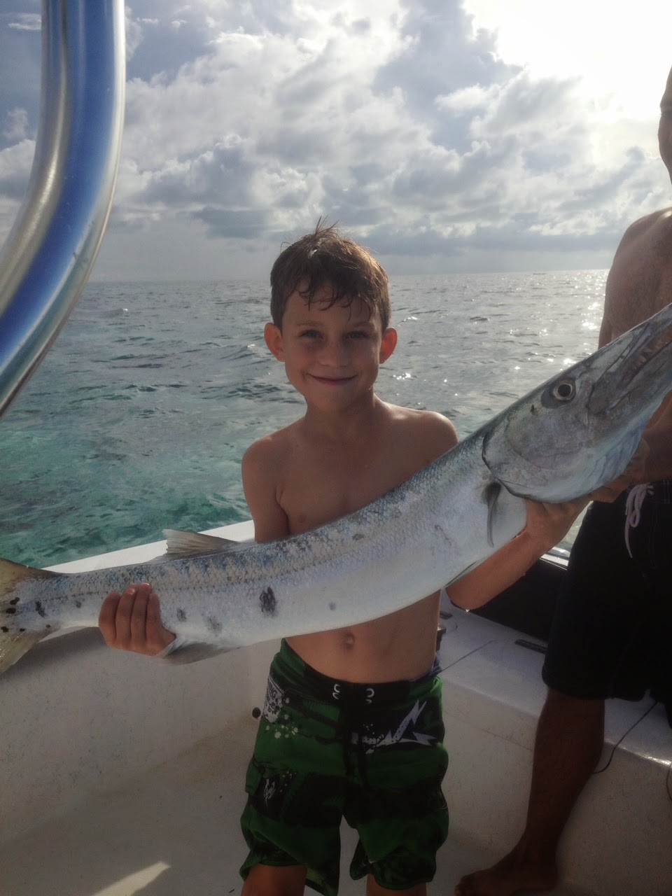fishing in san pedro belize boy with fish