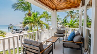 View from a balcony overlooking the beautiful beaches of Ambergris Caye, showcasing the appeal of the Belize Real Estate Market.