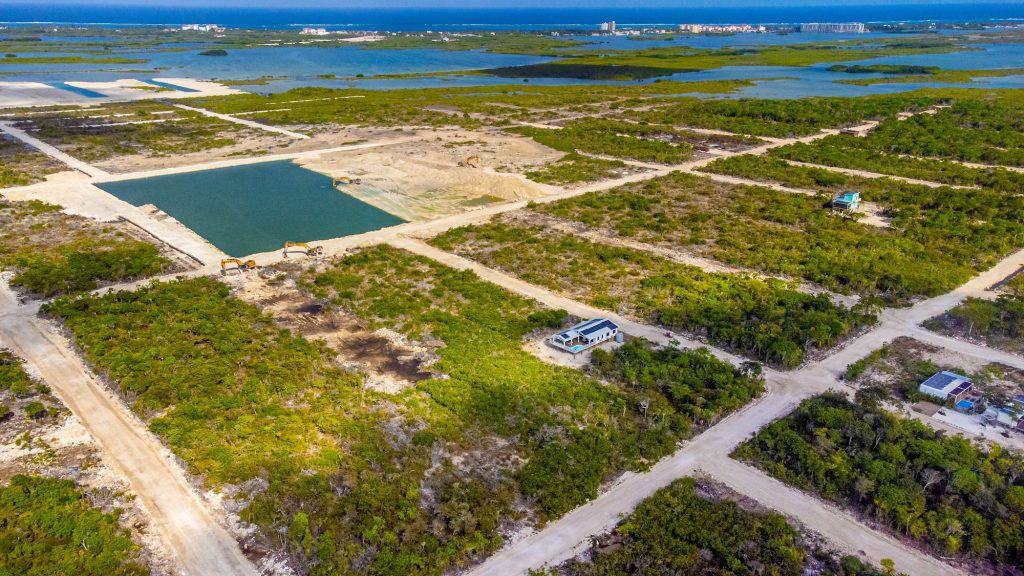 Aerial view of build-ready 70x100 lot in Secret Beach Belize real estate market