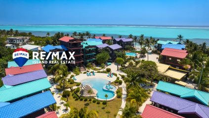 Aerial view of X’tan Ha Resort on Ambergris Caye showing beachfront condos, pool, dock, and turquoise Caribbean waters