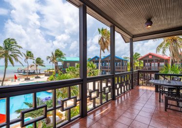 Ambergris Caye oceanfront condo view from balcony at X’TAN HA Resort overlooking the Caribbean Sea