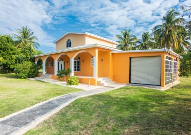 There is a quiet elegance to Villa Mango, a residence within the peaceful community of Consejo Shores
