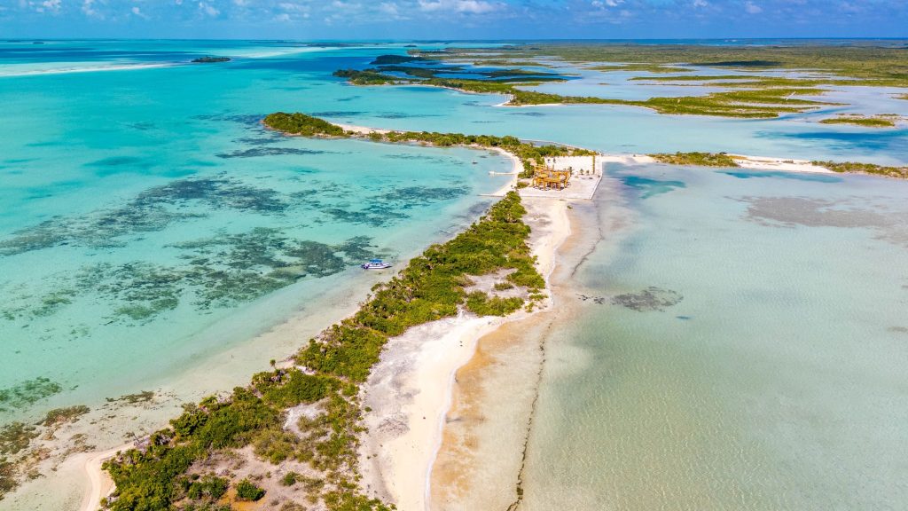 Secret Beach Ambergris Caye sea to lagoon lot aerial view showing Caribbean beachfront and lagoon frontage Belize real estate for sale