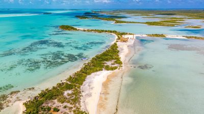 Secret Beach Ambergris Caye sea to lagoon lot aerial view showing Caribbean beachfront and lagoon frontage Belize real estate for sale