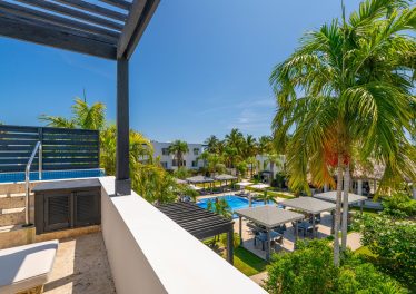 Private terrace with a plunge pool with resort and reef views at Las Terrazas