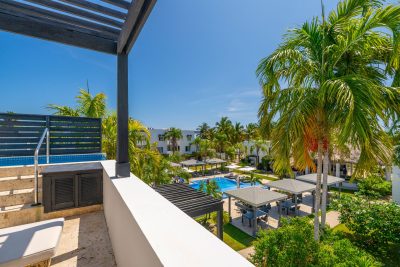 Private terrace with a plunge pool with resort and reef views at Las Terrazas