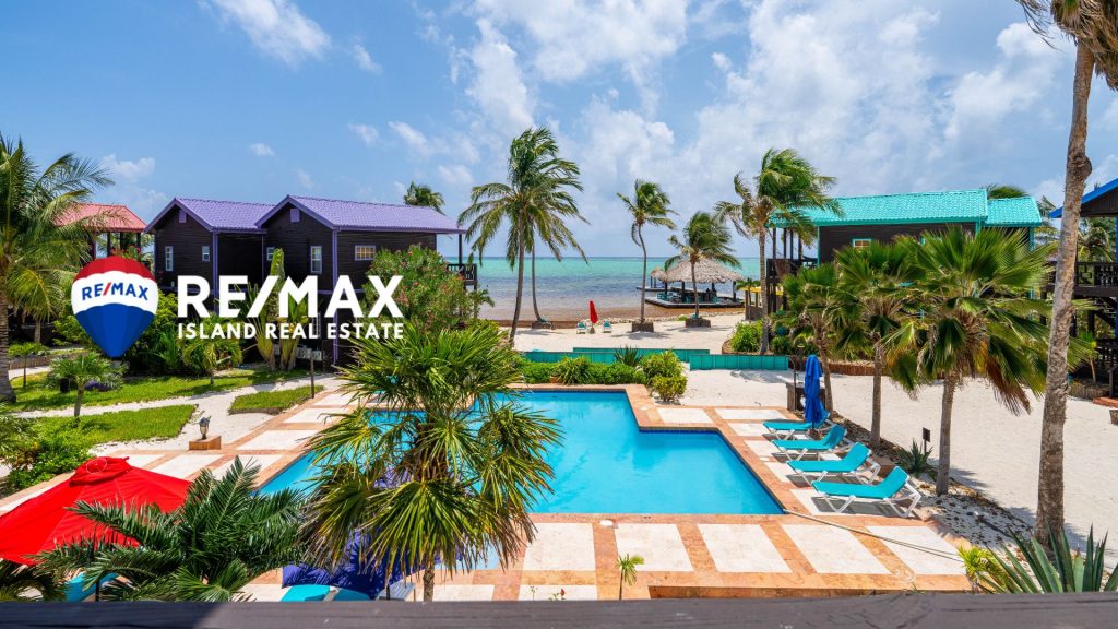 Over-water palapa bar and pier at X’tan Ha Resort, a premier destination for island living in Belize