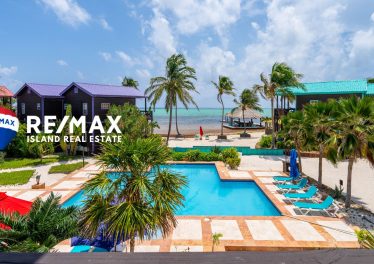 Over-water palapa bar and pier at X’tan Ha Resort, a premier destination for island living in Belize