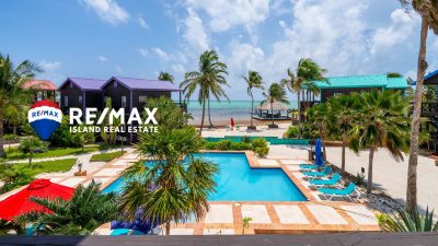 Over-water palapa bar and pier at X’tan Ha Resort, a premier destination for island living in Belize