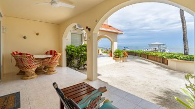 Ground floor private patio opening directly onto the beach at The Palms Oceanfront Suites Unit 11 in San Pedro Belize