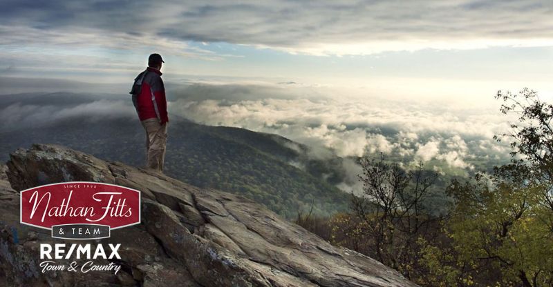 a man on top of the mountain