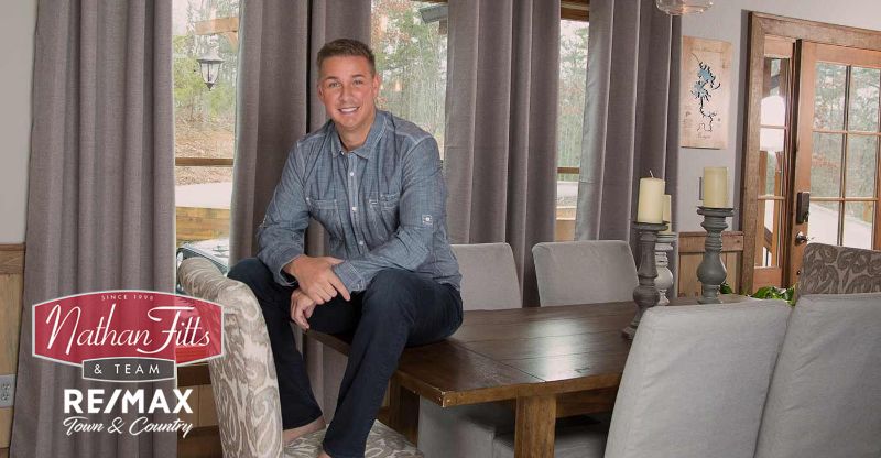 Nathan Fitts sitting on a dining table