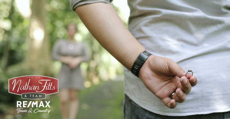 a man hiding a ring from his girlfriend