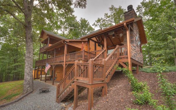 wooden house with trees in the background