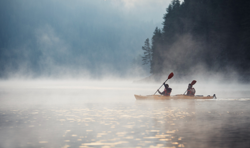 two people canoeing