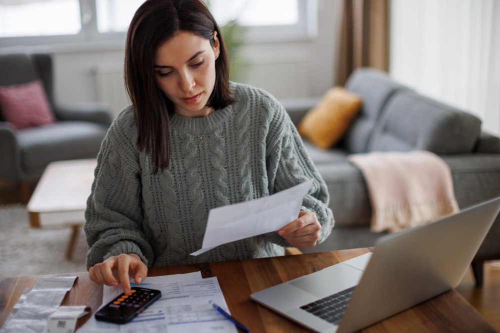 checking her monthly expenses