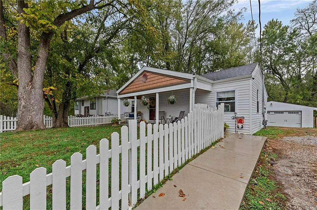 Behind the white picket fence on a quarter-acre city lot — 605 4th Street, Weston MO