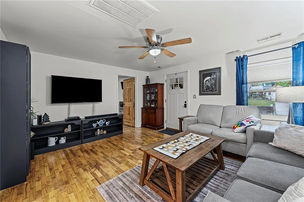 Hardwood floors run through the living room — 605 4th Street, Weston MO
