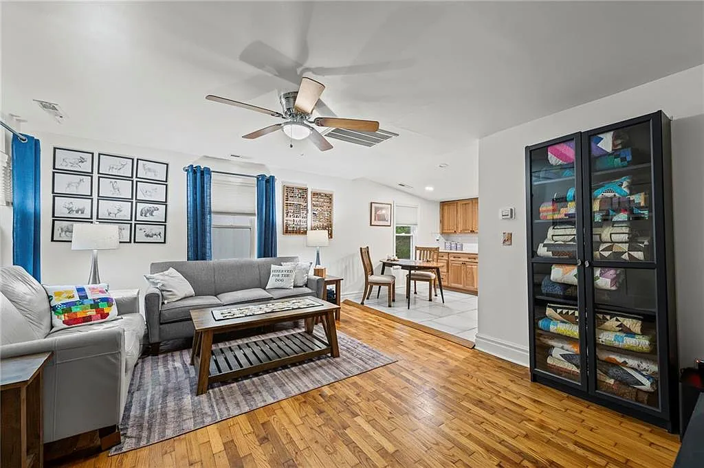 The living room opens straight into the kitchen and dining area — 605 4th Street, Weston MO