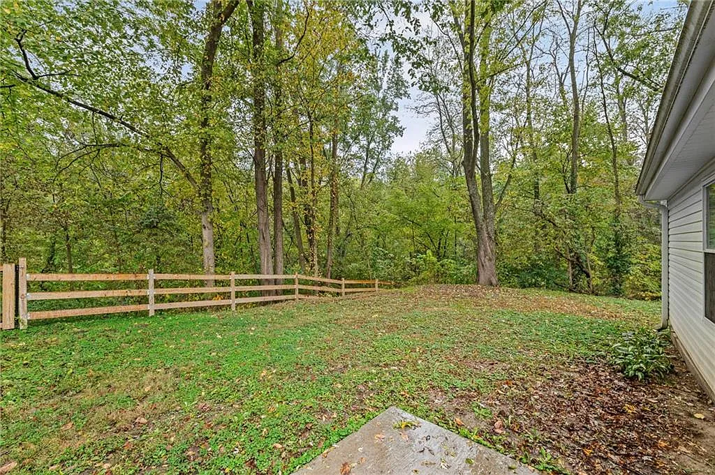 The backyard, with a small stream along the edge — 605 4th Street, Weston MO
